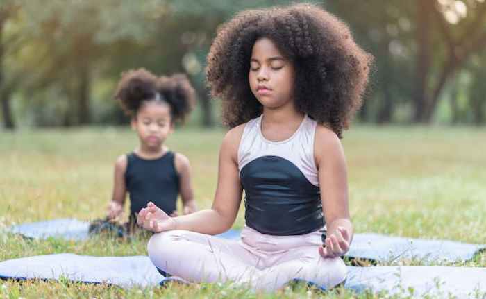 Meditating mindfulness meditation child boy kid yoga schools huffpost